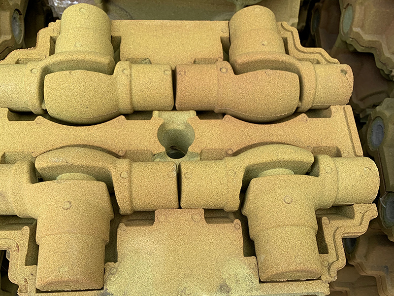 Як вирішити дефект пісочного наклеювання у виробництві сірого чавунного деталей за допомогою технології піску з покриттям плівки?